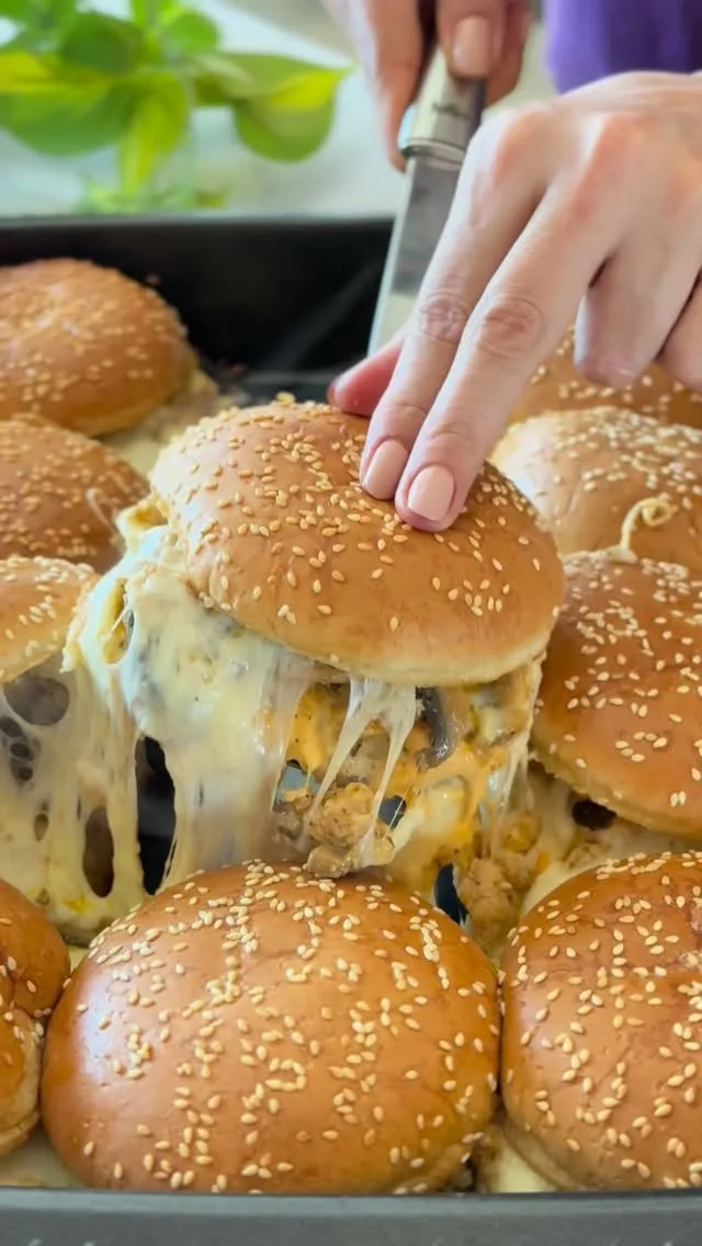 Cheesy sliders being served from tray